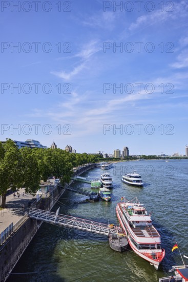 Rhine river, general architecture, Zoobrücke car bridge, footpath and cycle path, waterfront, boat launch, gangway, wharf, excursion boats, pedestrians as accessories, trees, bird's-eye view, blue sky, cirrus clouds, potion yard, Cologne, district-free city, North Rhine-Westphalia, Germany