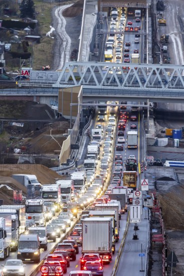 Traffic jam at the permanent construction site of the A8 motorway near Pforzheim-Ost. One side of the three-lane extension at the Enz Valley crossing is complete, the cars are driving on the new roadway. Construction has now begun in the direction of Karlsruhe. Niefern-Öschelbronn, Baden-Württemberg, Germany