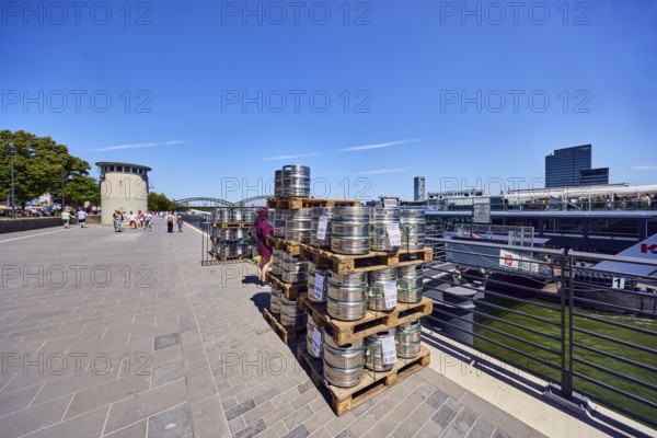 Pallets with beer barrels, boat launch, gangway, Rhine river, waterfront, level, metal railings, general architecture, pedestrians as a secondary motif, blue sky, cirrus clouds, Leystapelwerft, Cologne, district-free city, North Rhine-Westphalia, Germany