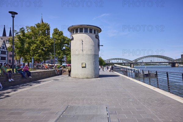 Level, river Rhine, waterfront, metal railing, lantern, sandstone wall, general architecture, boat launch, gangway, pedestrians and seated people as side motifs, trees, blue sky, cloudless, Leystapelwerft, Cologne, district-free city, North Rhine-Westphalia, Germany