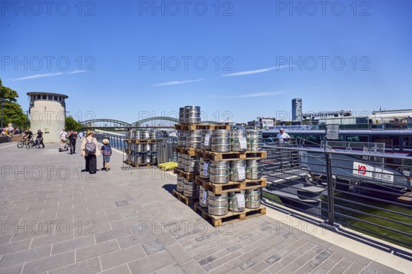 Pallets with beer barrels, boat launch, gangway, Rhine river, waterfront, level, metal railings, general architecture, pedestrians as a secondary motif, blue sky, cirrus clouds, Leystapelwerft, Cologne, district-free city, North Rhine-Westphalia, Germany