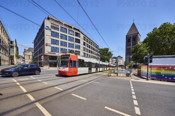 Gürzenich-Quartier, church tower of Klein St. Martin, general architecture, commercial building, modern architecture, car, tram lines, tram tracks, sidewalk, cycle path, trees, blue sky, cloudless, intersection of Augustinerstraße, Pipinstraße and Kleine Sandkaul, Cologne, district-free city, North Rhine-Westphalia, Germany