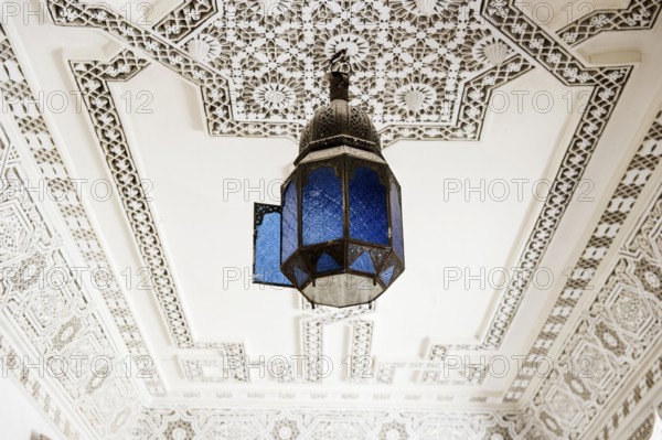 Lamp and stucco ceiling, Souk, Marrakech, Morocco