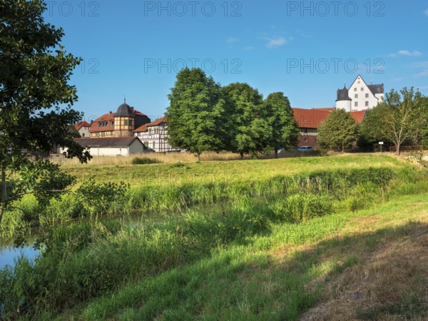 View across the Helme River to Heringen Castle, Thuringia, Germany