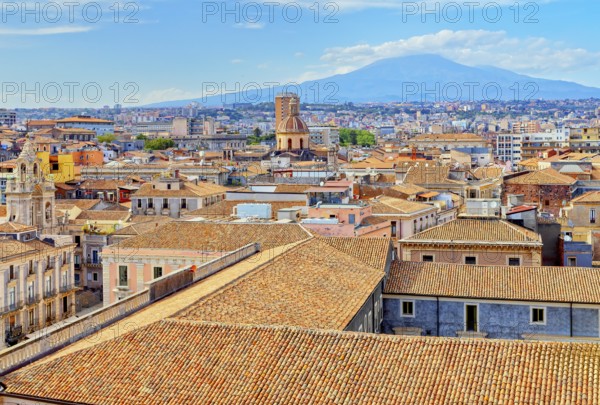 Elevated view of the town with Etna volcano in the distance, Catania, Sicily, Italy