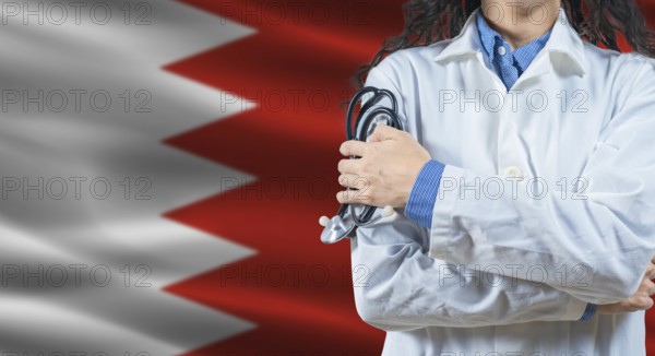 Healthcare professional with Bahrain flag background. Professional doctor holding stethoscope on Bahrain flag background