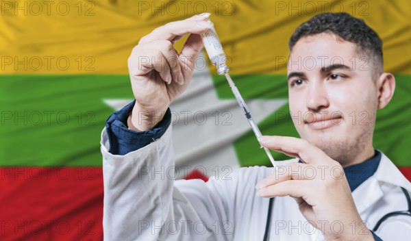 Doctor holding syringe on Myanmar flag background. Medical professional holding syringe with Burmese flag in the background