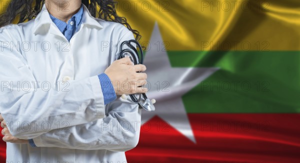 Healthcare professional with Myanmar flag background. Professional doctor holding stethoscope on Myanmar flag background
