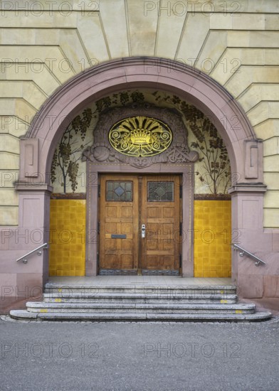 The main portal of the 120-year-old historic Hegau-Gymnasium in Singen am Hohentwiel with stonemasonry, art nouveau blacksmithing, district of Constance, Baden-Württemberg, Germany