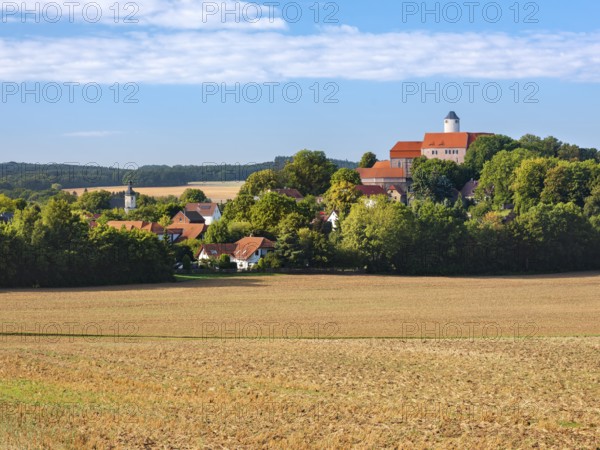 View of ploughed field at Schönfels Castle and Village in Lichtentanne, Saxony, Germany