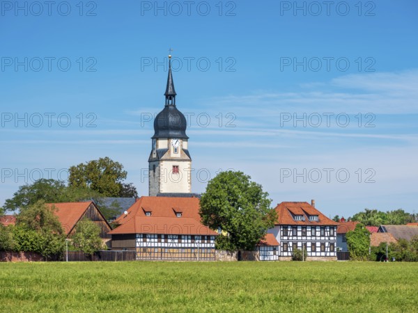 The village of Apfelstädt with the church of St. Walpurgis and half-timbered houses, Thuringia, Germany