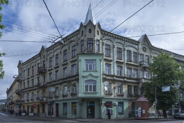 19th century dilapidated tenement house, restored bay window, Lemberg, Ukraine