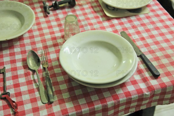 Museo della Civiltà Contadina, Farmers' Museum, dining table with crockery and cutlery, La Rocca, Novellara Castle, Emilia-Romagna, Italy