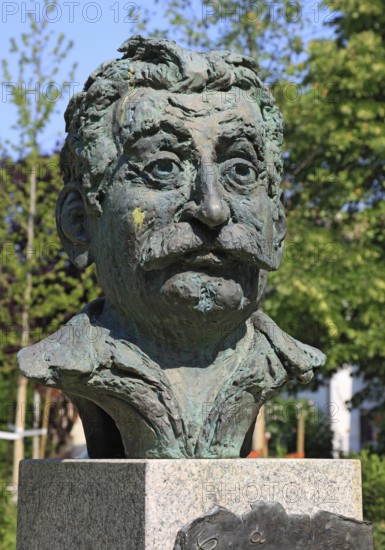 Brescello, statue of the writer Giovannino Guareschi in Parco Giovannino Guareschi, author of the films by Don Camillo and Peppone, Emilia-Romagna, Italy