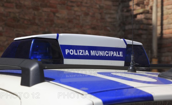 Polizia municipale, police car in Italy, marking on the roof of the car, lettering. Polizia Municipale, Polizia Locale or Polizia Comunale is the civil Italian municipal police