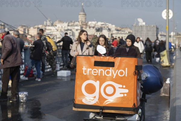 Istanbul, Turkey. December 2nd 2025. A Trendyol delivery motorbike parked on the Galata Bridge, Trendyol is one of the most popular e-commerce web platforms in Turkey