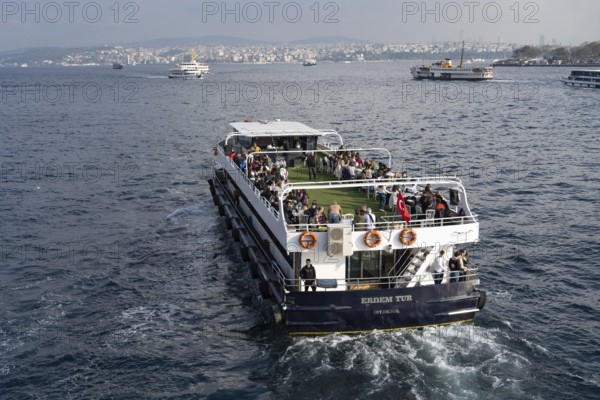 Istanbul, Turkey. December 2nd 2025. A Turkish tour boat with tourists leaves the Golden Horn and Galata Bridge and heads towards the Bosphorus Straight and the Black Sea