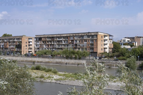 Gori, Georgia. September 9th 2025. Soviet style housing buildings beside the Kura Rive in Gori, a Georgian city famous for being the birth place of Joseph Stalin former Soviet leader. Georgia