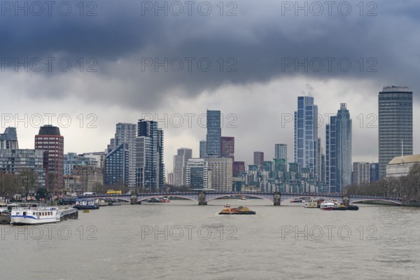 London, United Kingdom. January 31st, 2025. Heavy clouds over a panorama view of the city of London with offices and tall buildings, offices and hotels, seen from Westminster Bridge over the River Thames. London, UK