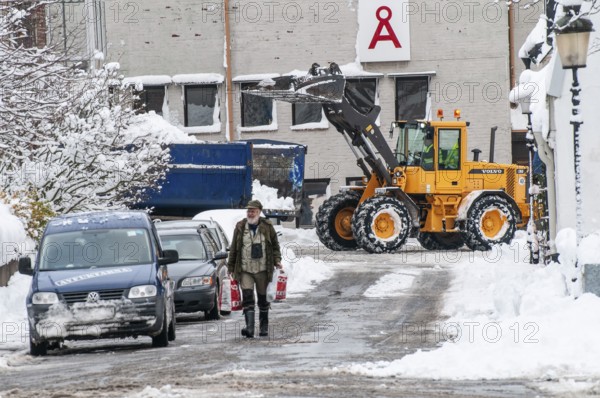 Loader clearing snow on streets in Ystad, Skåne County, Sweden, Scandinavia