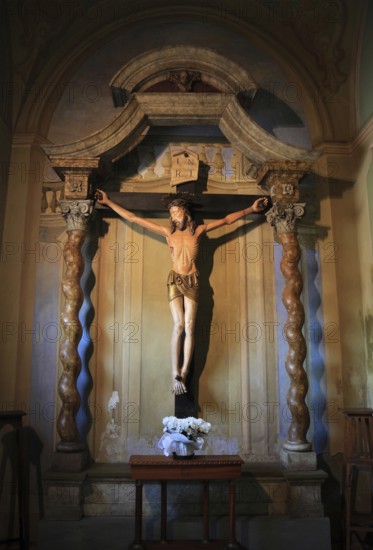 Brescello village, cross, cross with the talking Jesus from the movie Don Camillo and Peppone, in the church of Brescello, Emilia-Romagna, Italy