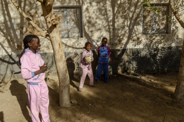 Aswan, Egypt. December 20th 2012 Young Nubian children play football in Nuba Nasr, a modern village housing displaced Nubians after the building of Aswan High dam. Egypt