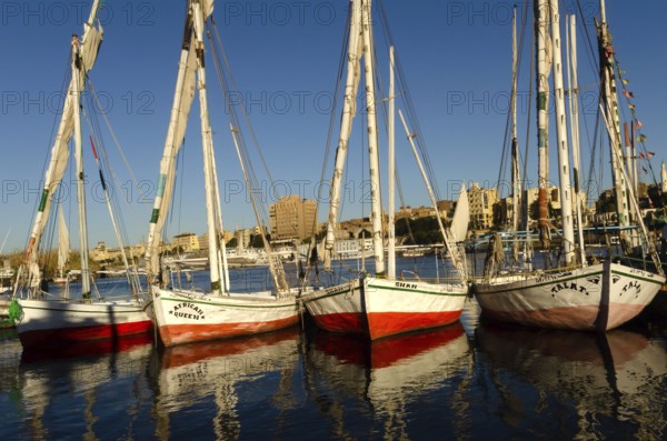 Aswan, Egypt. January 12th 2013 Beautiful painted Egyptian Felucca sail boats moored at Elephantine Island, River Nile, Aswan, Egypt