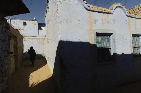 Aswan, Egypt. January 11th 2013 Bright blue traditional Nubian houses in the West bank Nile village at Aswan Upper Egypt