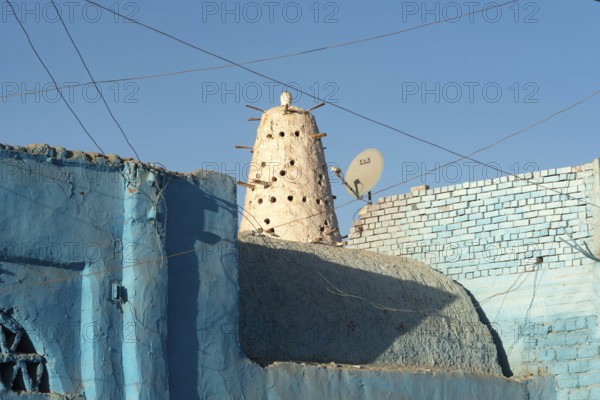 Aswan, Egypt. December 10th 2022 Blue Nubian architecture and traditional style Dovecote or mud brick Pigeon House used to raise and farm pigeons, popular in Egyptian cuisine, village life on the Nile, Aswan, Egypt
