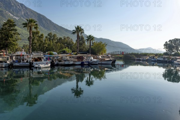 Akyaka, Mugla, Turkey. September 8th 2022 Boats moored in the beautiful harbour at the entrance to the Azmak River, at the Turkish Riviera seaside town of Akyaka on the south west coast of Turkey