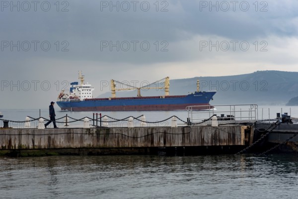 Canakkale, Turkey. February 18th 20222 The Mediqueen bulk carrier ship passing through the Dardanelles straight near the Gallipoli Peninsular and the Turkish port city of Canakkale heading towards the Bosporus and Black Sea, Turkey