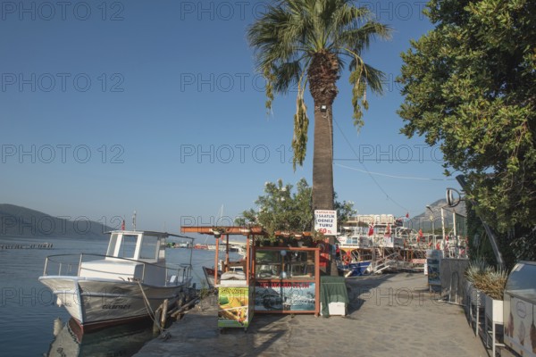 Akyaka, Mugla, Turkey. September 8th 2022 A boat moored in the beautiful harbour of Turkish Riviera seaside town of Akyaka on the south west coast of Turkey