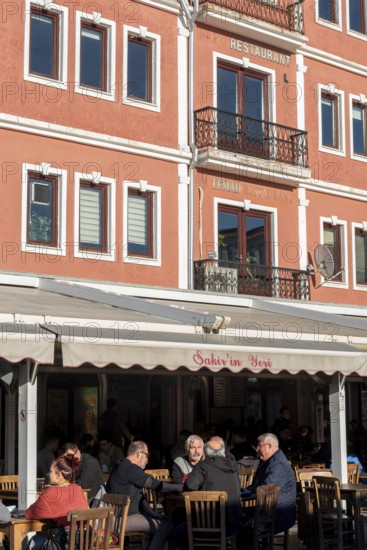 Canakkale, Turkey. February 18th 2022 A popular cafe restaurant on the harbour of Canakkale old town, busy with shops and tourists beside the Dardanelles and Gallipoli Peninsular, Western Turkey