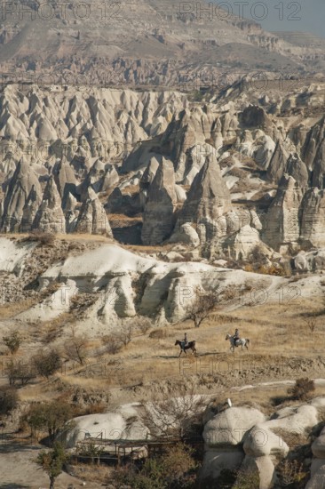 Cappadocia, Turkey. November 8th 2017 Horse riders in the Gorkundere Valley near the Anatolian town of Goreme in Cappadoca, Turkey. The dramatic volcanic landscape of central Anatolia in Turkey is known as the Land of Beautiful Horses