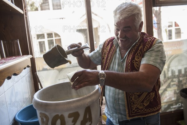 Ortahisar, Cappadocia, Turkey. September 19th 2018 Huseyin the Boza maker of Ortahisar Boza is a traditional Turkish fermented malt drink made from bulgar, rice, yeast and chick peas with cinamon