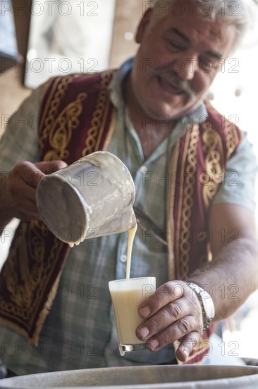 Ortahisar, Cappadocia, Turkey. September 19th 2018 Huseyin the Boza maker of Ortahisar Boza is a traditional Turkish fermented malt drink made from bulgar, rice, yeast and chick peas with cinamon
