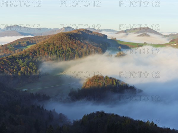 View from the Gisliflue of the Jura foothills covered in fog from the left, Wasserfluh, Summerholde, Asperstrihen, in the morning light, Talheim, Canton, Aargau, Switzerland
