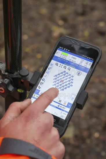 Castrop-Rauxel, North Rhine-Westphalia, Germany - Theme photo - Explosive soundings - Deep soundings are used to check dud suspicion points. 11-meter deep boreholes are secured with plastic pipes and borehole measurements of ferromagnetic suspicions are carried out with a probe. Measurement points are controlled via an app on the mobile phone