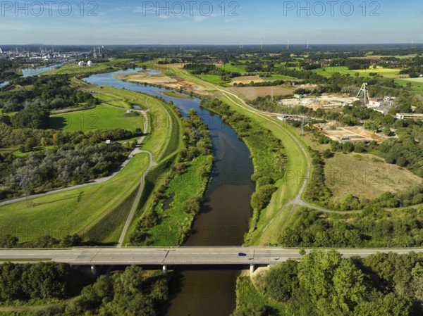 Haltern-Marl, North Rhine-Westphalia, Germany - Lippe, flood protection in the Haltern-Lippramsdorf-Marl area (HaLiMa) . Flood protection on the River Lippe by relocating the dyke and thus extending the floodplain. View downstream In front: Lippramsdorfer Straße bridge On the right: excavation site of the former Auguste Victoria colliery's Shaft 8. Marl Chemical Park at the back