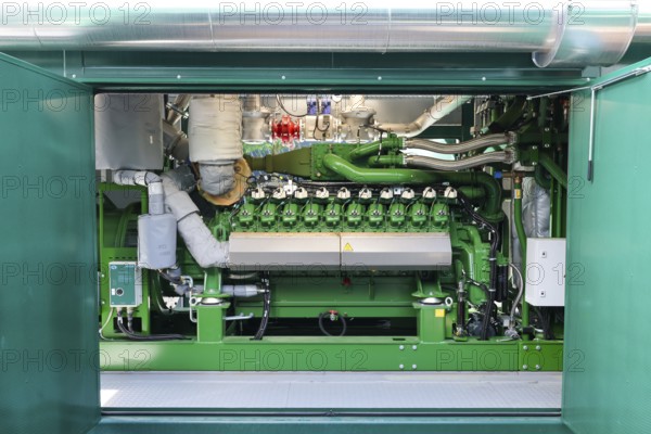 Dinslaken, North Rhine-Westphalia, Germany - Combined heat and power plants (CHP) generate electricity from wastewater digester gases, which is used by the Emscher-Mündung sewage treatment plant for its own power supply. The old CHP unit at the Emscher-Mündung sewage treatment plant in Dinslaken is getting on in years and needs to be replaced. Temporary rental CHP units (pictured here) relieve the stationary CHP units so that they can then be renewed or replaced