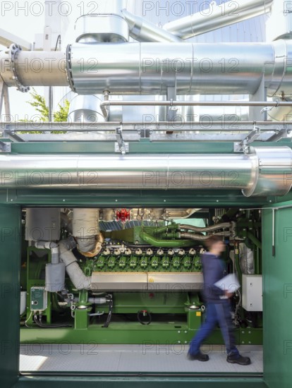 Dinslaken, North Rhine-Westphalia, Germany - Combined heat and power plants (CHP) generate electricity from wastewater digester gases, which is used by the Emscher-Mündung sewage treatment plant for its own power supply. The old CHP unit at the Emscher-Mündung sewage treatment plant in Dinslaken is getting on in years and needs to be replaced. Temporary rental CHP units (pictured here) relieve the stationary CHP units so that they can then be renewed or replaced