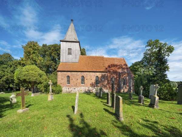 The village church of Groß Zicker with old cemetery, Mönchgut peninsula, Rügen island, Mecklenburg-Western Pomerania, Germany