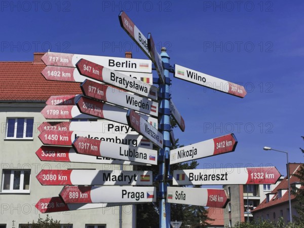 A signpost shows the distances to various European capitals, Gizycko, Masuria, Poland