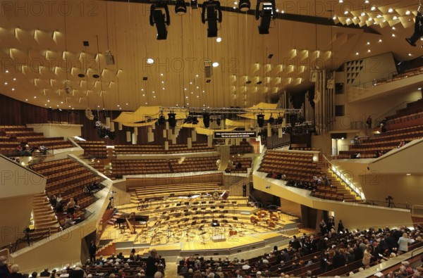 Philharmonie Berlin, modern concert hall with illuminated stage and empty rows of seats, Berlin