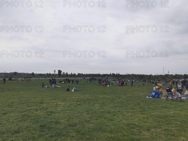 Extensive Tempelhofer Feld with people enjoying free time on a large meadow, Berlin