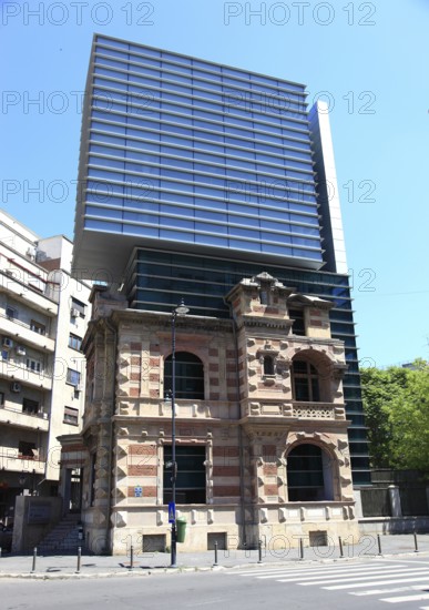 Romania, capital Bucharest, Bucuresti, House of the Union of Romanian Architects, The building is known for its distinctive architectural combination of old and new, with a modern glass tower rising from the ruins of a historic house, the original Paucescu House building was built around 1880 in the French Renaissance style and was severely damaged during the Romanian Revolution of 1989