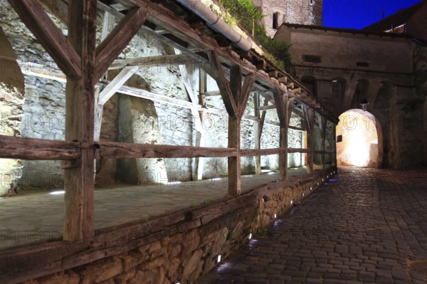 Romania, the way through the hour tower at blue hour in the historic old town of Sighisoara, German Sighisoara, town in Mures district in Transylvania, UNESCO World Heritage Site