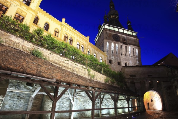 Romania, the hour tower at the blue hour in the historic old town of Sighisoara, German Sighisoara, town in Mures district in Transylvania, UNESCO World Heritage Site