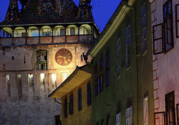 Romania, hour tower, at blue hour in the historic old town of Sighisoara, German Sighisoara, town in Mures district in Transylvania, UNESCO World Heritage Site