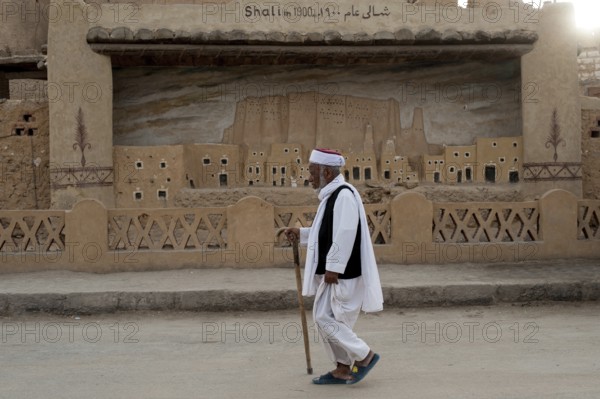 Siwa, Egypt. March 11th 2018 A local Siwian man wearing traditional clothes walking in the streets of Siwa Oasis, an urban oasis in Egypt situated between the Qattara Depression and the Great Sand Sea in the Western Desert